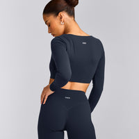 SoftMotion™ Scoop Neck Long Sleeve Crop Top with Built in Bra Shelf with Grey Logo | True Blue