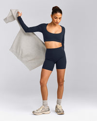 SoftMotion™ Scoop Neck Long Sleeve Crop Top with Built in Bra Shelf with Grey Logo | True Blue