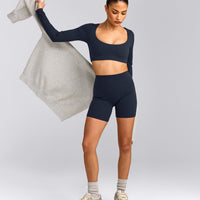 SoftMotion™ Scoop Neck Long Sleeve Crop Top with Built in Bra Shelf with Grey Logo | True Blue