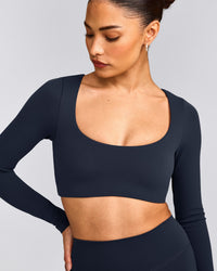 SoftMotion™ Scoop Neck Long Sleeve Crop Top with Built in Bra Shelf with Grey Logo | True Blue