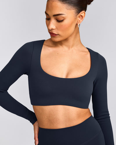 SoftMotion™ Scoop Neck Long Sleeve Crop Top with Built in Bra Shelf with Grey Logo | True Blue