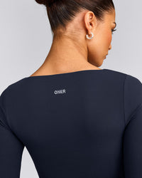 SoftMotion™ Scoop Neck Long Sleeve Crop Top with Built in Bra Shelf with Grey Logo | True Blue