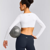 SoftMotion™ Scoop Neck Long Sleeve Crop Top with Built in Bra Shelf with Grey Logo | White
