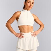 EasyLift™ Zip High Neck Sports Bra with Grey Logo | Marshmallow White