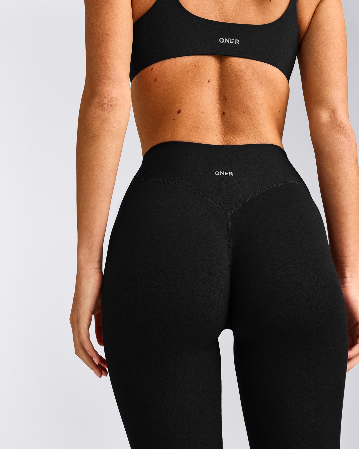SoftMotion™ 3/4 Length Leggings with Grey Logo | Black