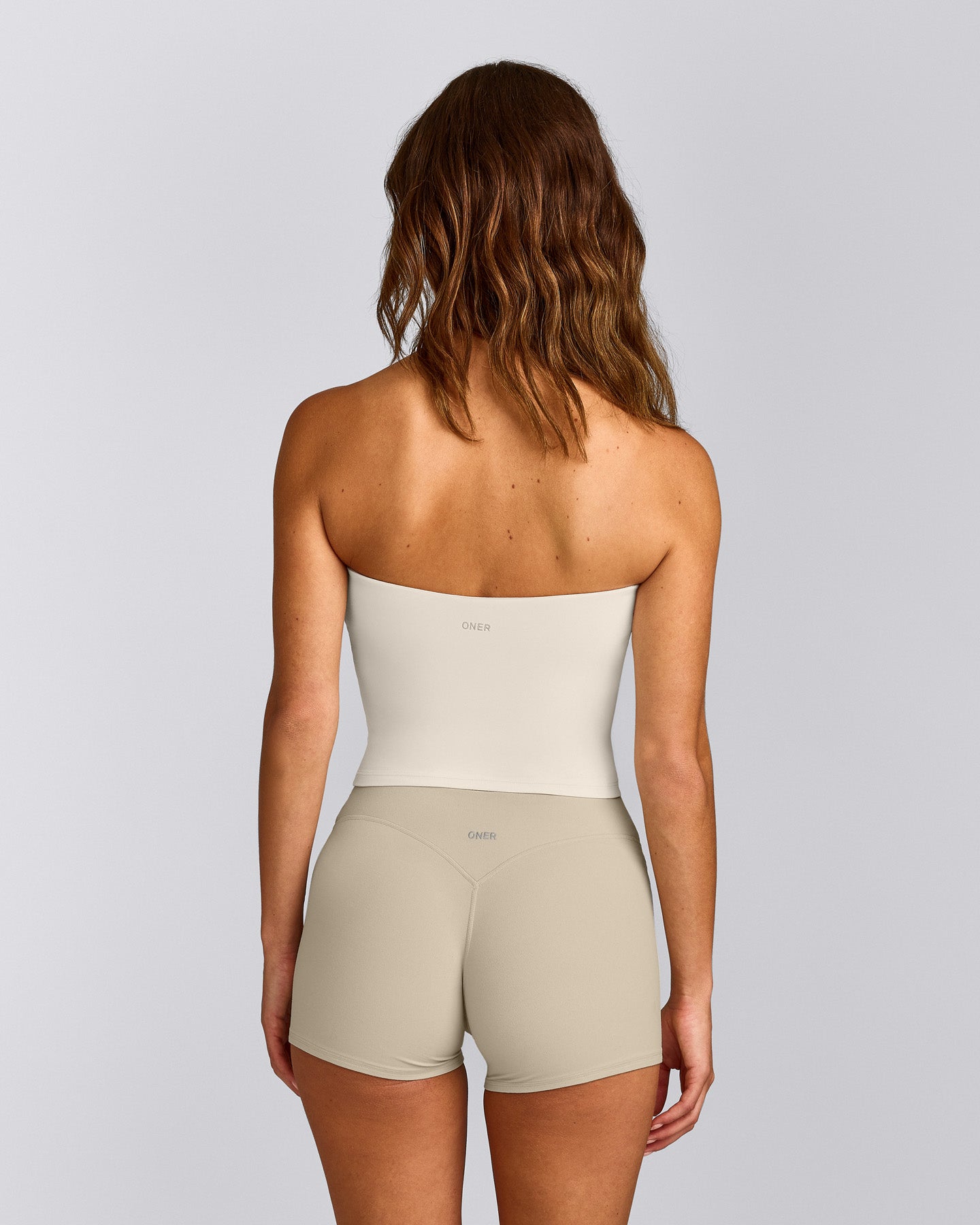 SoftMotion™ Bandeau Mid Vest with Built in Bra Shelf with Grey Logo | Marshmallow White