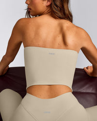 SoftMotion™ Bandeau Mid Vest with Built in Bra Shelf with Grey Logo | Oatmeal
