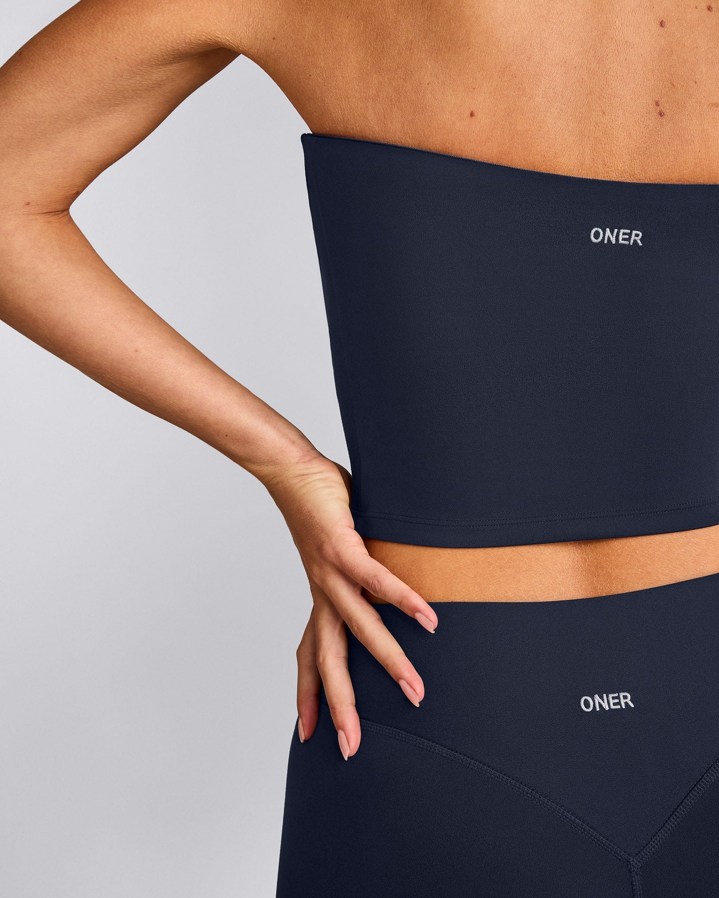 SoftMotion™ Bandeau Mid Vest with Built in Bra Shelf with Grey Logo | True Blue