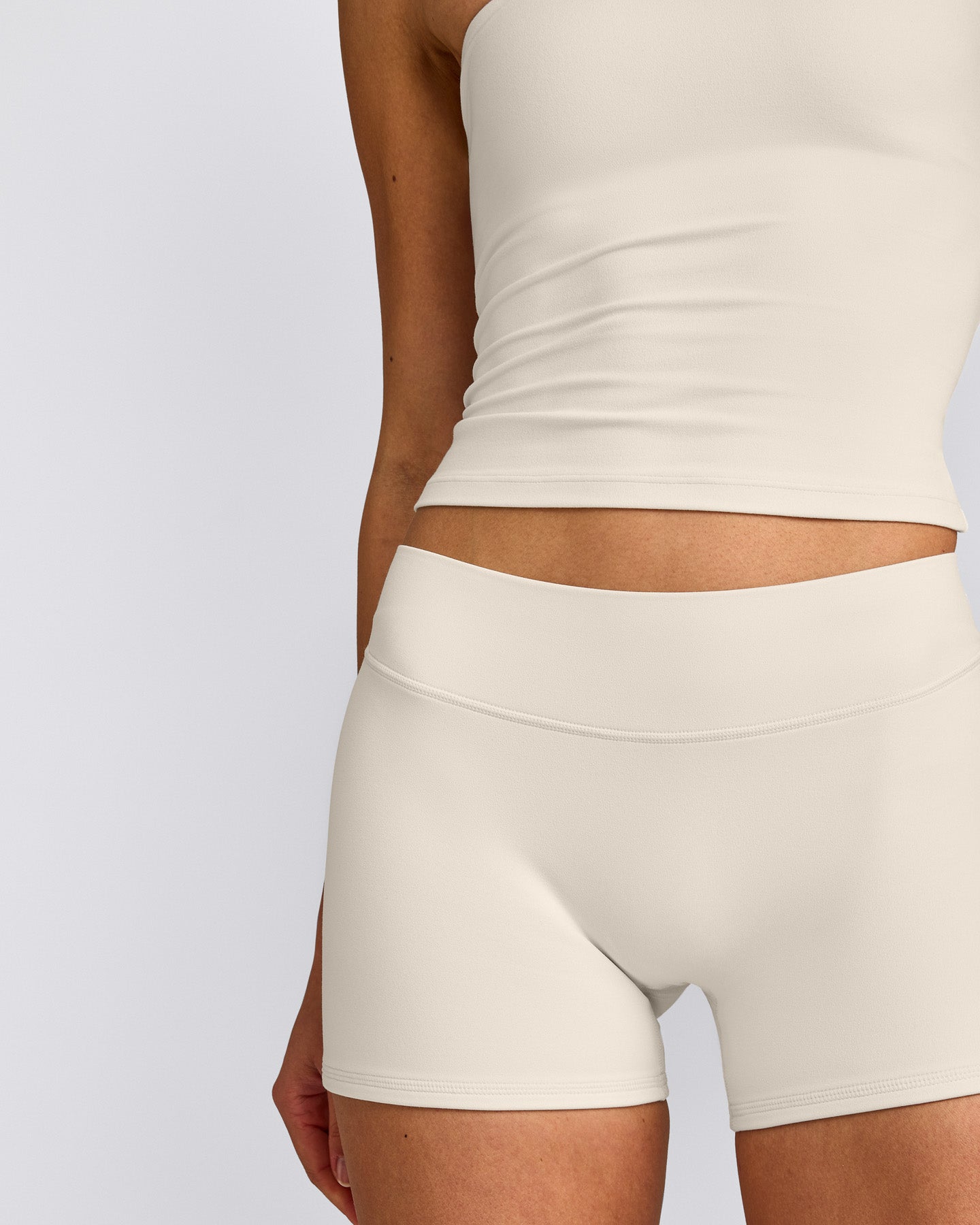 SoftMotion™ Double Layer Mid Rise Micro Shorts 4" with Grey Logo | Marshmallow White