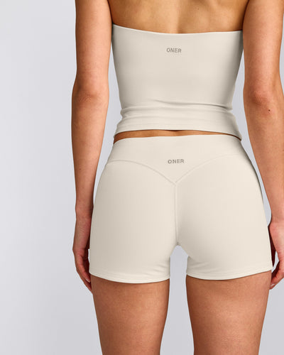 SoftMotion™ Double Layer Mid Rise Micro Shorts 4" with Grey Logo | Marshmallow White