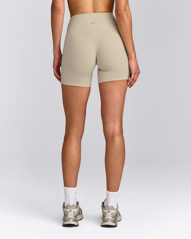 SoftMotion™ High Waisted Shorts 6" with Grey Logo | Oatmeal