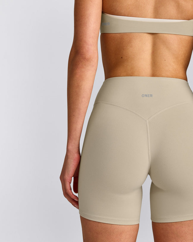 SoftMotion™ High Waisted Shorts 6" with Grey Logo | Oatmeal