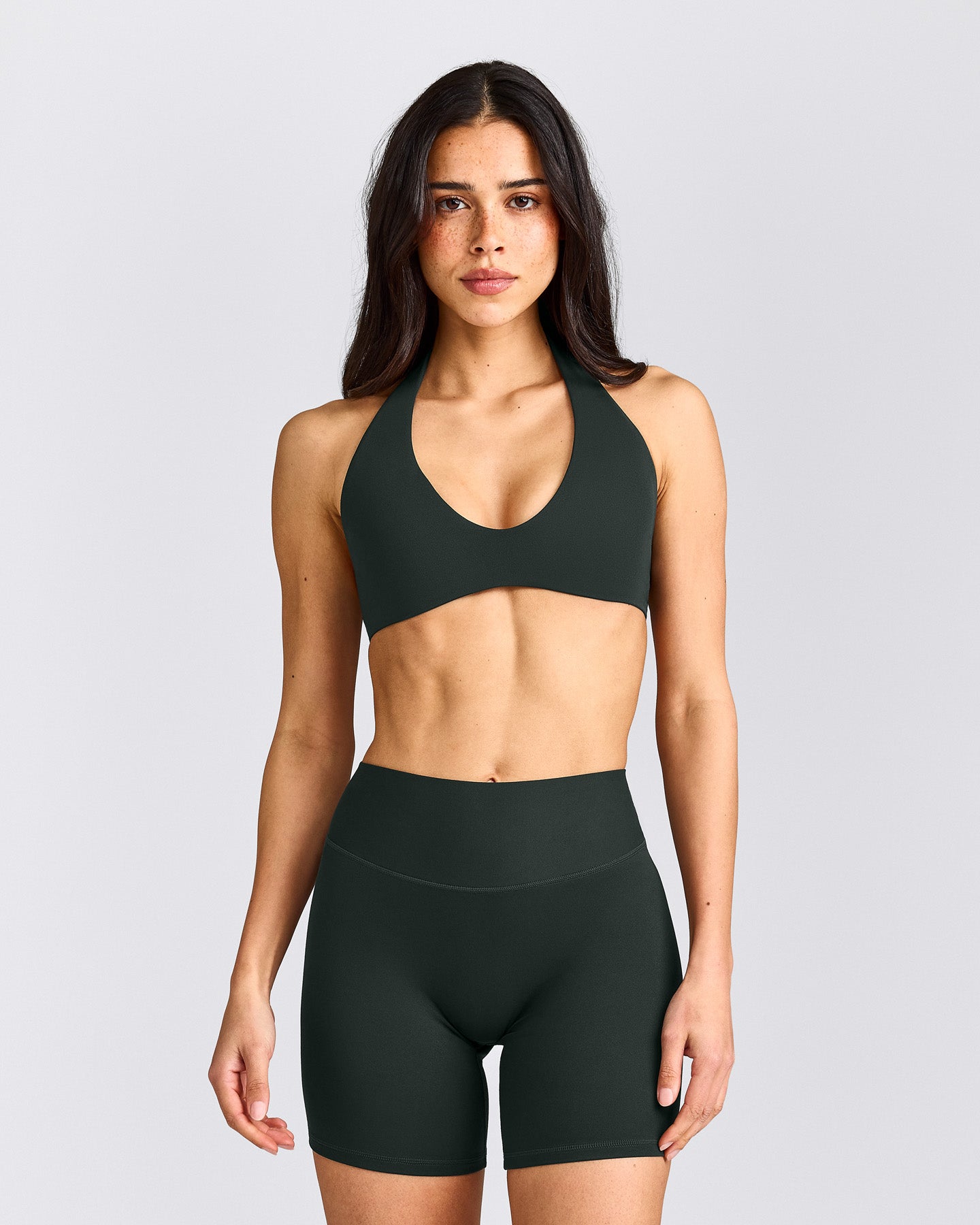 SoftMotion™ Minimal Halter Neck Bralette with Grey Logo | Emerald Noir