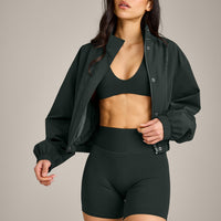 SoftMotion™ Minimal Halter Neck Bralette with Grey Logo | Emerald Noir