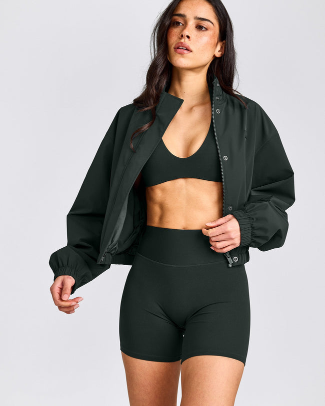 SoftMotion™ Minimal Halter Neck Bralette with Grey Logo | Emerald Noir