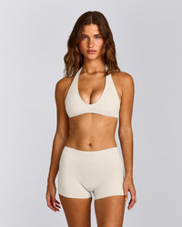 SoftMotion™ Minimal Halter Neck Bralette with Grey Logo | Marshmallow White