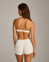 SoftMotion™ Minimal Halter Neck Bralette with Grey Logo | Marshmallow White