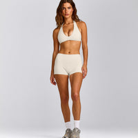 SoftMotion™ Minimal Halter Neck Bralette with Grey Logo | Marshmallow White