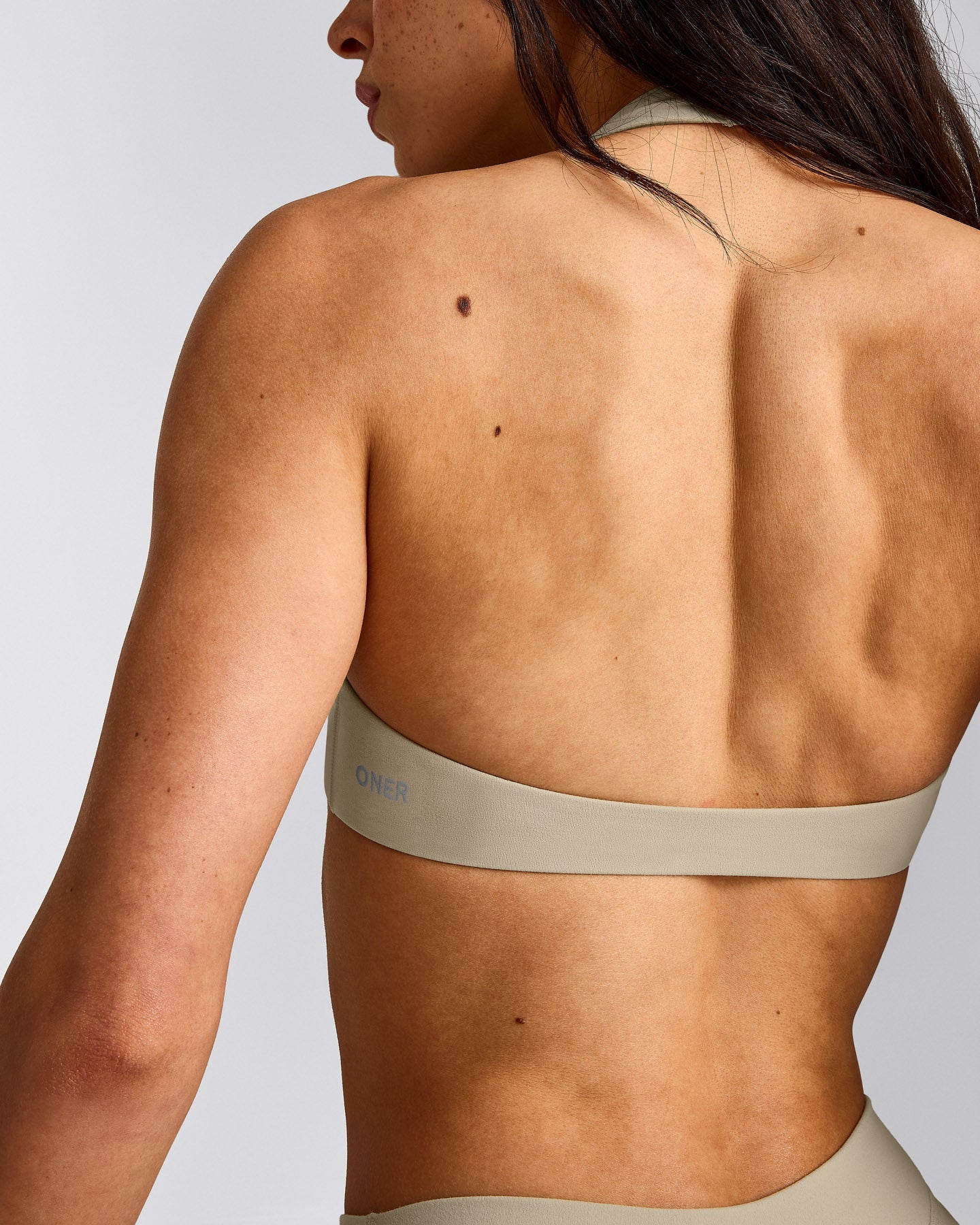 SoftMotion™ Minimal Halter Neck Bralette with Grey Logo | Oatmeal