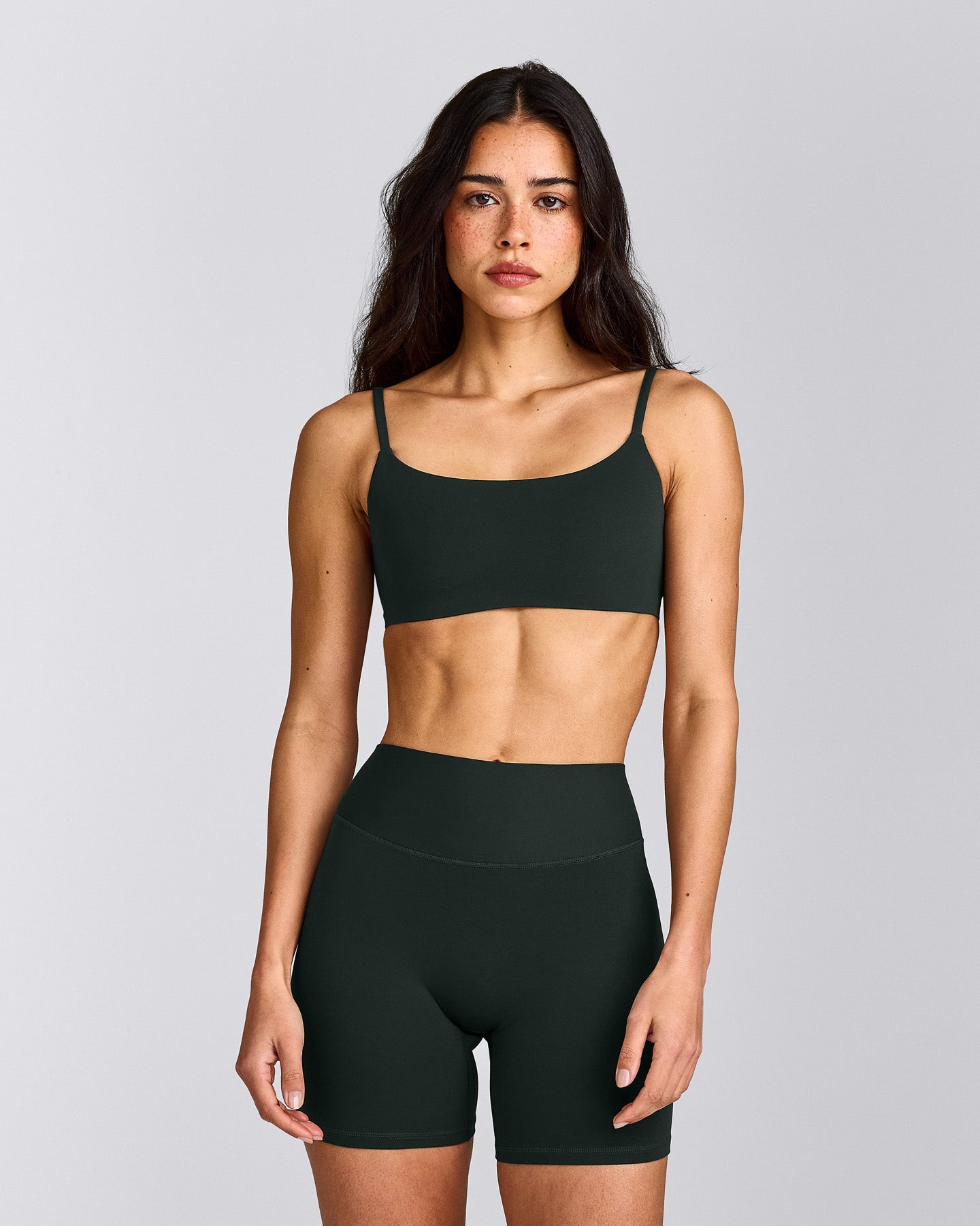 SoftMotion™ Strappy Sports Bra with Grey Logo | Emerald Noir