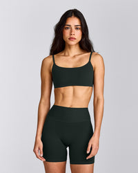 SoftMotion™ Strappy Sports Bra with Grey Logo | Emerald Noir