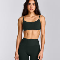 SoftMotion™ Strappy Sports Bra with Grey Logo | Emerald Noir