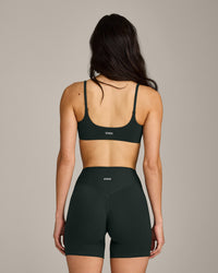 SoftMotion™ Strappy Sports Bra with Grey Logo | Emerald Noir
