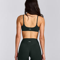 SoftMotion™ Strappy Sports Bra with Grey Logo | Emerald Noir