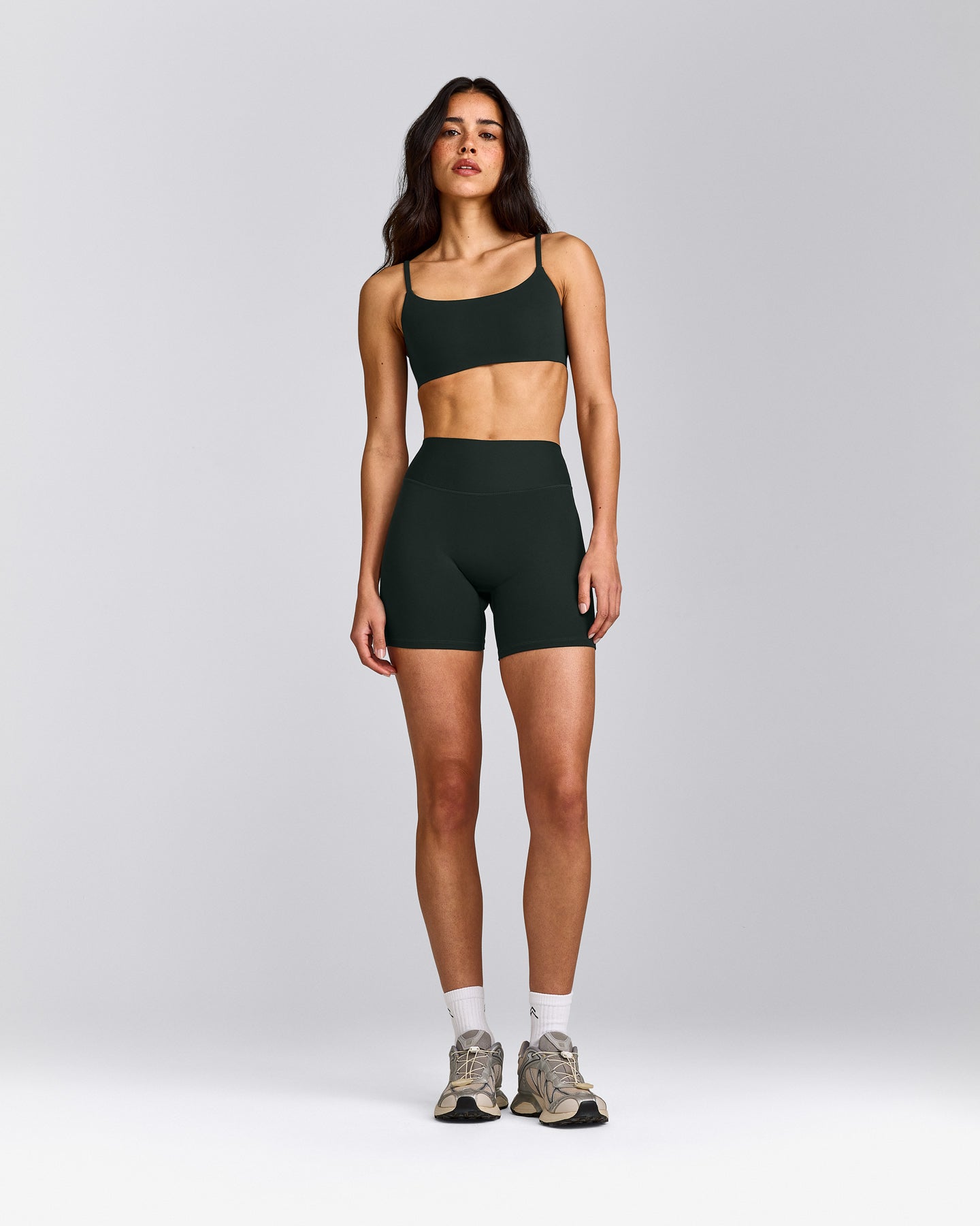SoftMotion™ Strappy Sports Bra with Grey Logo | Emerald Noir