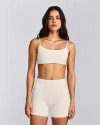 SoftMotion™ Strappy Sports Bra with Grey Logo | Marshmallow White