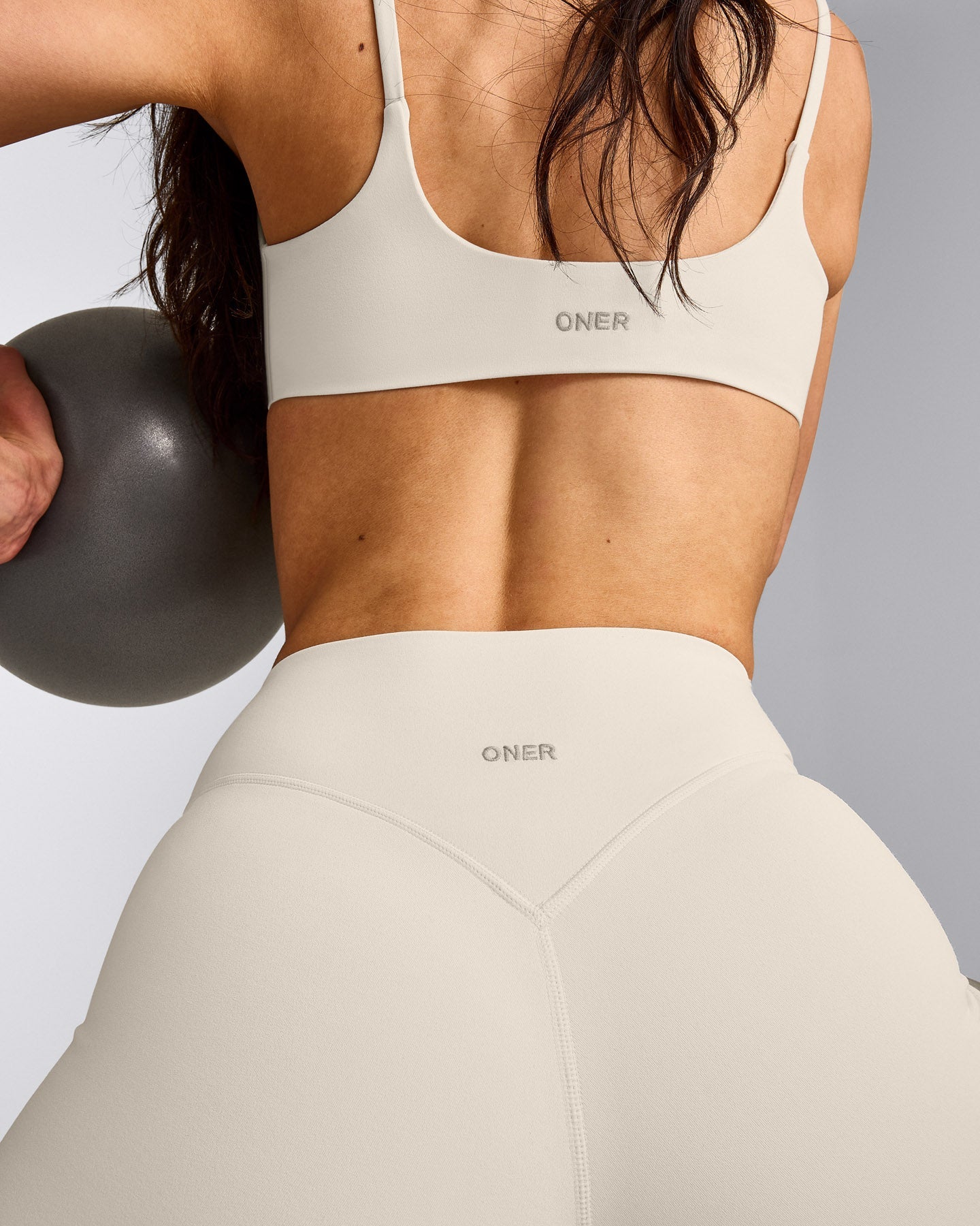 SoftMotion™ Strappy Sports Bra with Grey Logo | Marshmallow White