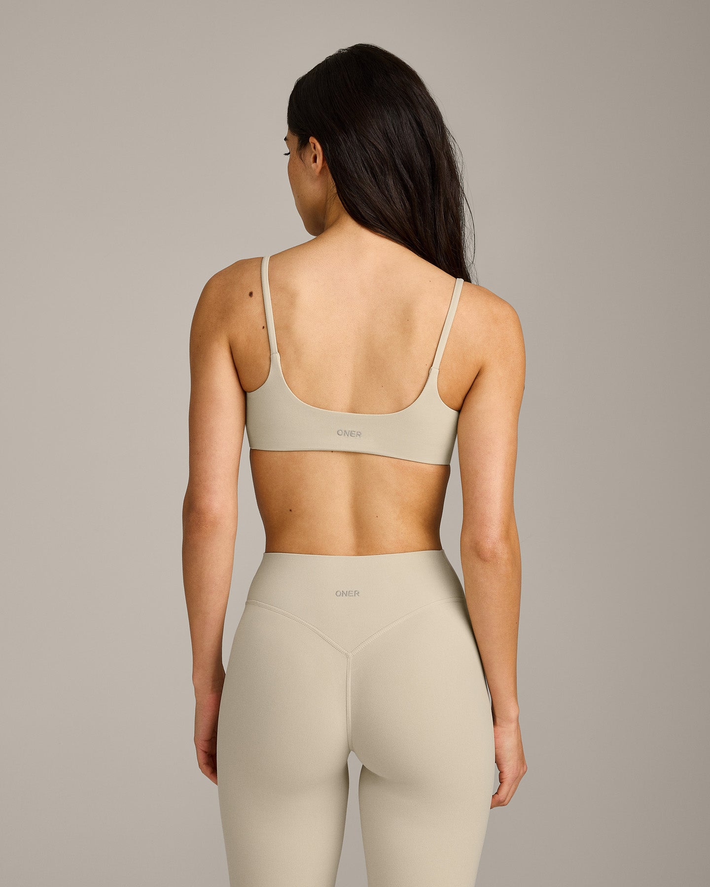 SoftMotion™ Strappy Sports Bra with Grey Logo | Oatmeal