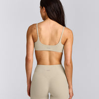SoftMotion™ Strappy Sports Bra with Grey Logo | Oatmeal