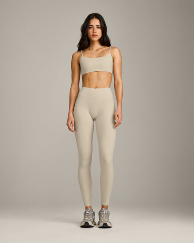 SoftMotion™ Strappy Sports Bra with Grey Logo | Oatmeal
