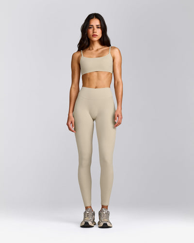 SoftMotion™ Strappy Sports Bra with Grey Logo | Oatmeal