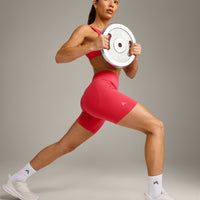 EffortlessLift™ Seamless Mid Rise Shorts with Grey Logo | Charged Pink
