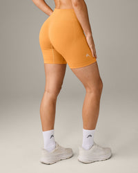 EffortlessLift™ Seamless Mid Rise Shorts with Grey Logo | Powdered Orange