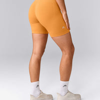 EffortlessLift™ Seamless Mid Rise Shorts with Gray Logo | Powdered Orange