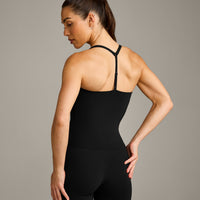 UnifiedMove™ T Back Mid Vest with Built in Bra Shelf with Reflective Logo | Black