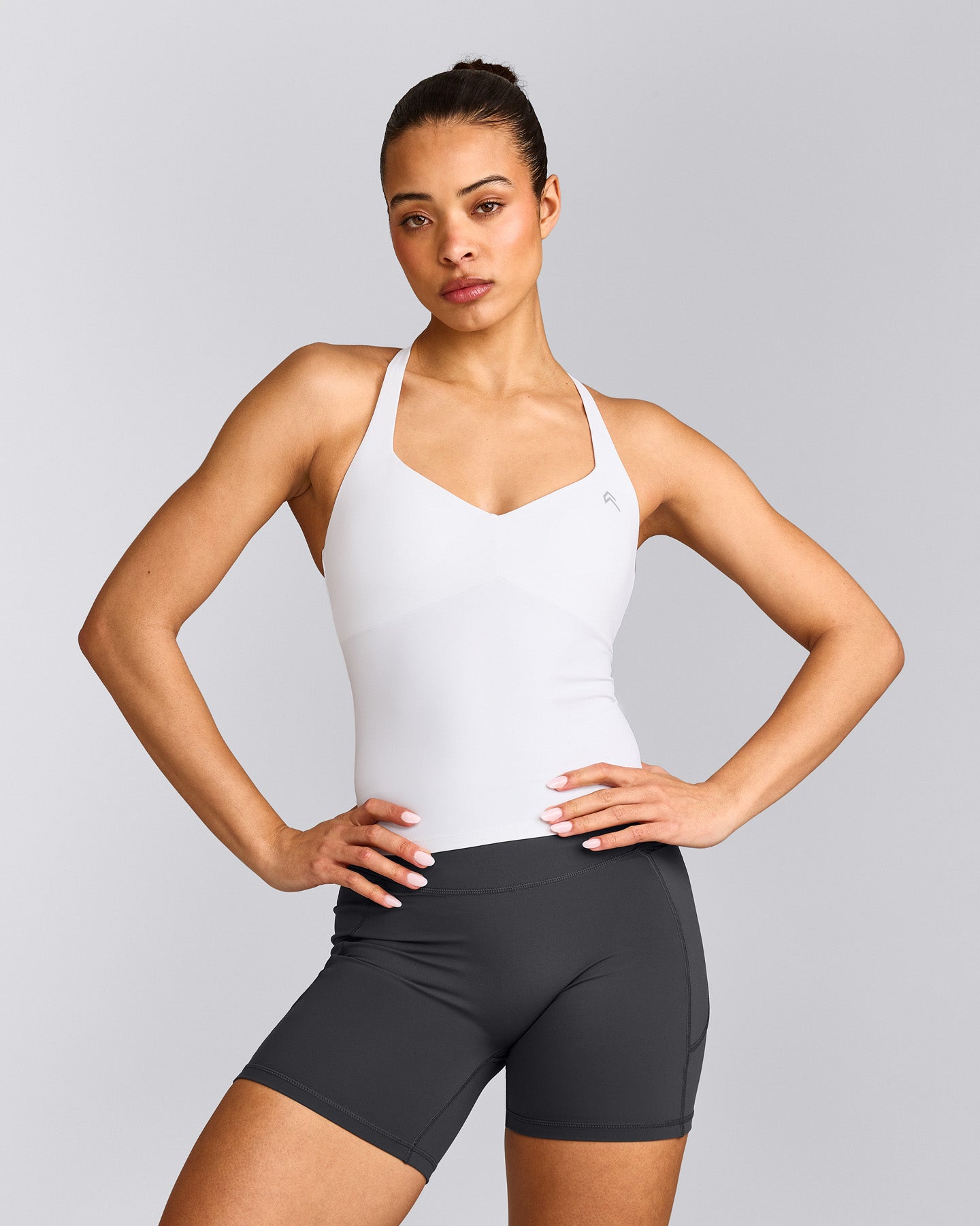 UnifiedMove™ T Back Mid Vest with Built in Bra Shelf with Reflective Logo | White
