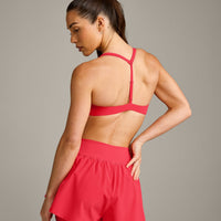 UnifiedMove™ T Back Minimal Bralette with Reflective Logo | Charged Pink