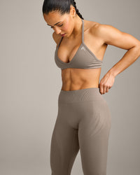 EnhanceLift™ Seamless Minimal Halter Neck Bralette with Grey Logo | Warm Minky