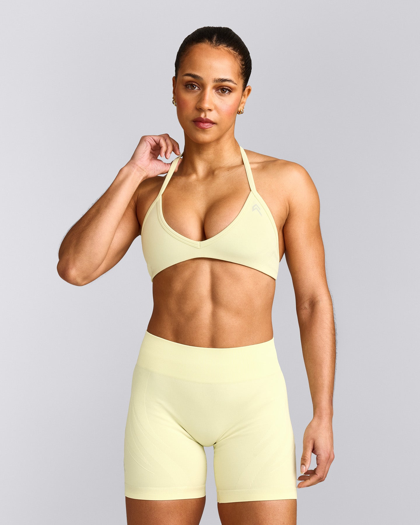 EnhanceLift™ Seamless Minimal Halter Neck Bralette with Grey Logo | Pastel Yellow