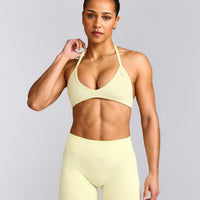 EnhanceLift™ Seamless Minimal Halter Neck Bralette with Grey Logo | Pastel Yellow