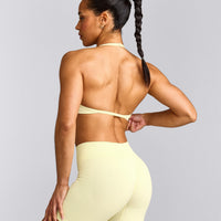 EnhanceLift™ Seamless Minimal Halter Neck Bralette with Grey Logo | Pastel Yellow