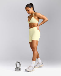 EnhanceLift™ Seamless Minimal Halter Neck Bralette with Grey Logo | Pastel Yellow