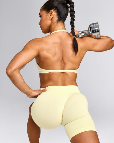 EnhanceLift™ Seamless Minimal Halter Neck Bralette with Grey Logo | Pastel Yellow