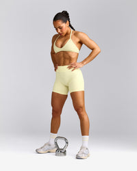 EnhanceLift™ Seamless Minimal Halter Neck Bralette with Grey Logo | Pastel Yellow