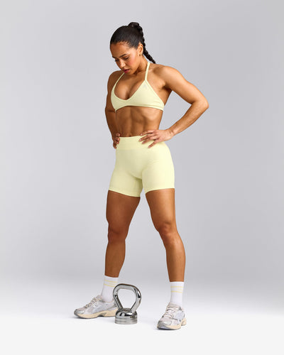 EnhanceLift™ Seamless Minimal Halter Neck Bralette with Grey Logo | Pastel Yellow