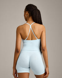 EnhanceLift™ Seamless Strappy Racer Vest with Built in Bra Shelf with Grey Logo | Cloud Blue